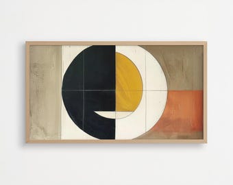 May include: Abstract art print in a wooden frame. The artwork features a large black and yellow circle, a white semi-circle, and rectangular sections in tan and orange. The design is modern and minimalist, suitable for home decor.