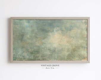May include: Abstract art print in a light wooden frame. The artwork features a blend of muted greens, blues, and beige tones, creating a soft, textured appearance. The text "VINTAGE GROVE - Art Co." is printed at the bottom.