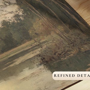 May include: A close-up of a canvas print depicting a landscape scene of trees and a river. The print has a textured, faded appearance, giving it a vintage feel. The text "REFINED DETAIL" is printed in the bottom right corner.