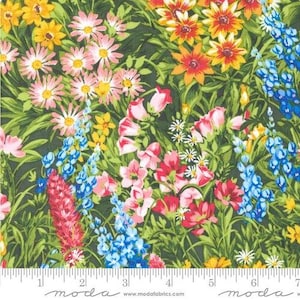 May include: A fabric with a floral pattern featuring a variety of colorful flowers. The design includes pink, yellow, orange, and blue blooms set against a dark green background. The fabric has a ruler along the bottom edge.