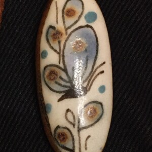 Ceramic hippy beatnick flower child necklace. Butterfly on leather lanyard.
