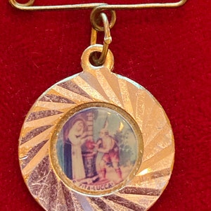 Religious icon pin from Europe. 3/3” across.