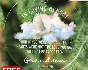 May include: A clear, round memorial ornament with the text "IN LOVING MEMORY" and "Grandma 1942-2025". It features a white dove flying above clouds, with the words "YOUR WINGS WERE READY, BUT OUR HEARTS WERE NOT, THE LOVE YOU GAVE WILL NOT BE FORGOTTEN."