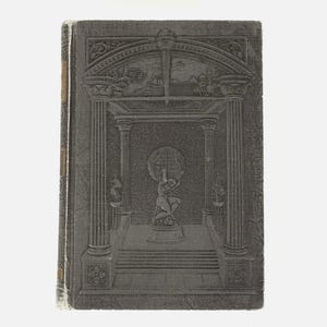 May include: A vintage book with a dark gray cover featuring an embossed design. The cover depicts a classical architectural scene with columns, a figure holding a globe, and intricate details. The spine is a lighter color.