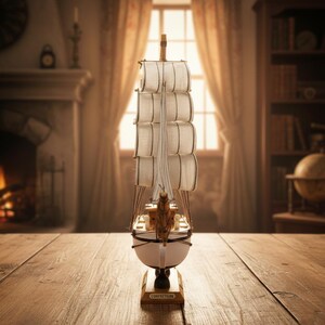 May include: A detailed model sailboat with white sails and a wooden hull. The miniature ship is displayed on a wooden surface, with the word "CORRECTION" on the base. The background includes a fireplace, window, and bookshelves.