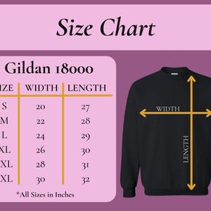 May include: Black Gildan 18000 sweatshirt with a size chart. The chart shows measurements in inches for sizes S to 3XL. The chart includes width and length measurements for each size. The text "Size Chart" is at the top.