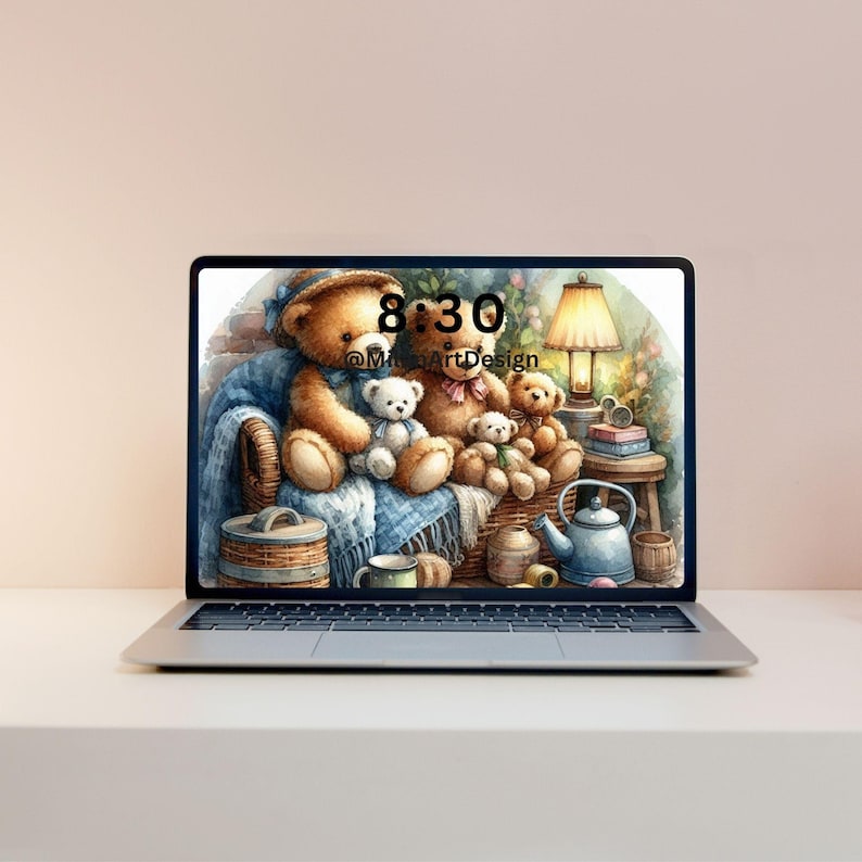 May include: Laptop screen displaying a cozy illustration of teddy bears in a wicker basket, with a blue blanket and a lamp. The time 8:30 is displayed on the screen, along with the text "@MilaArtDesign".