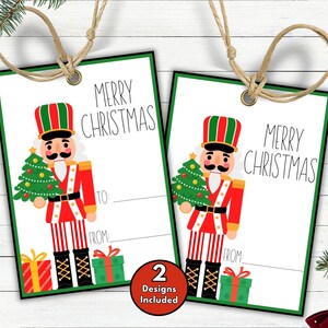 May include: Two Christmas gift tags with a green border and a cartoon nutcracker holding a Christmas tree. The tags read "MERRY CHRISTMAS" and have space to write "TO:" and "FROM:" with a red and green gift box at the bottom.