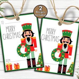 May include: Two Christmas gift tags with a green border and a nutcracker design. The tags read "Merry Christmas" and include a space to write "To" and "From". The nutcracker wears a red coat and green hat.
