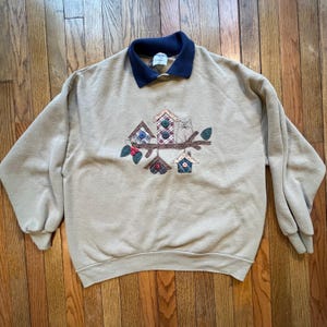 May include: A white ceramic mug with a black handle and the text "But First, Coffee" in a handwritten style. The mug is on a white surface. The mug is approximately 4 inches tall.