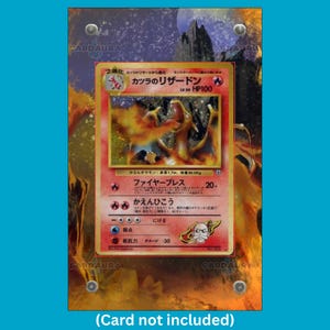 May include: A rectangular acrylic display case featuring four silver corner screws, designed to hold a trading card. The background insert displays a fiery, dark landscape with a moon, while the text CARDAURA is visible in the corners of the frame.