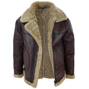 May include: A brown leather jacket with a shearling lining and collar. The jacket has a zip closure and a classic aviator style. The interior and collar are a light tan color, contrasting with the dark brown exterior.