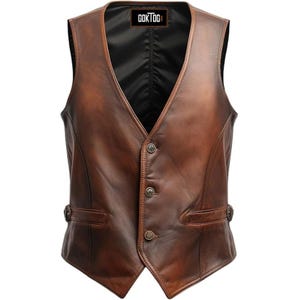 May include: A brown leather vest with a V-neck and three button closure. The vest has two small pockets and adjustable side straps. The brand name "GOKTOG" is printed on a tag at the top. The vest is made of a distressed leather.