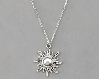 Shining Sun pendant with silver embroidery