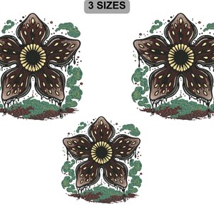 May include: Embroidered Demogorgon flower design in three sizes. The design features a brown, petal-shaped flower with a yellow center and dripping details. Green and brown accents surround the flower, with the text "3 SIZES" at the top.