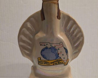 Decantador de whisky Jim Beam Vintage 1968, con forma de concha marina de Florida, sede central iridiscente