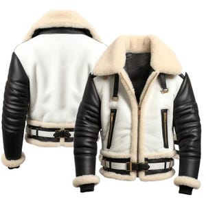 Puede incluir: Chaqueta de aviador blanca y negra con cuello y forro de borrego color crema. La chaqueta presenta mangas de cuero negro, cuerpo blanco y cinturón con hebilla. Cierre de cremallera y herrajes dorados.