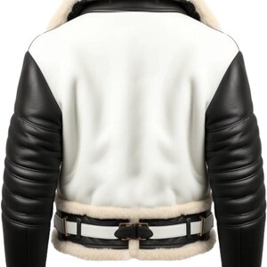May include: A white and black leather jacket with a cream-colored shearling collar and cuffs. The jacket features black leather sleeves and a white body. A white belt with a black buckle cinches the waist. A stylish outerwear garment.