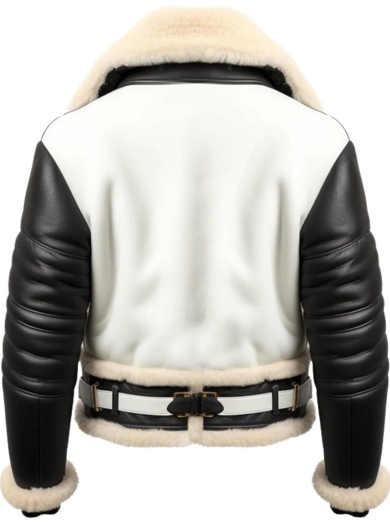 May include: A white and black leather jacket with a cream-colored shearling collar and cuffs. The jacket features black leather sleeves and a white body. A white belt with a black buckle cinches the waist. A stylish outerwear garment.