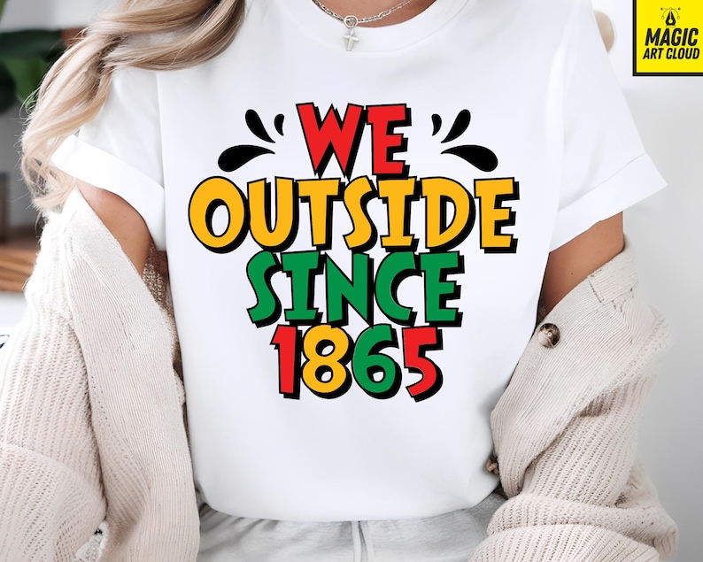 May include: White t-shirt with the text "WE OUTSIDE SINCE 1865" in red, yellow, green, and black. The shirt has a crew neck and short sleeves. The text is in a bold, colorful font.