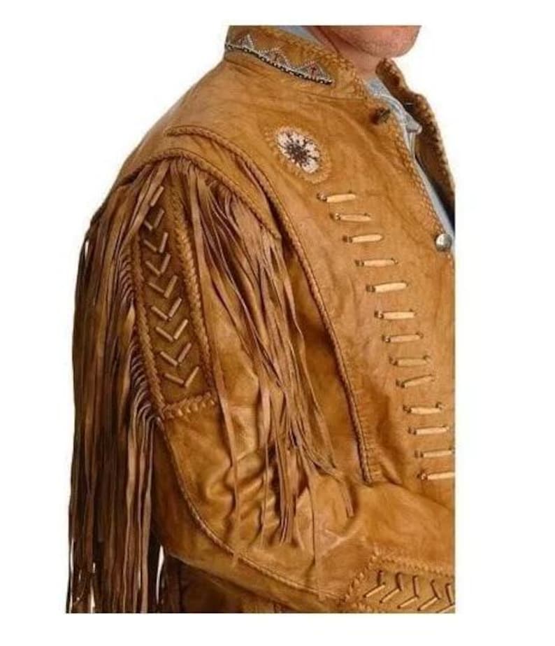 May include: A brown leather jacket with fringe detailing and beaded accents. The jacket has a zipper closure and a stand-up collar.