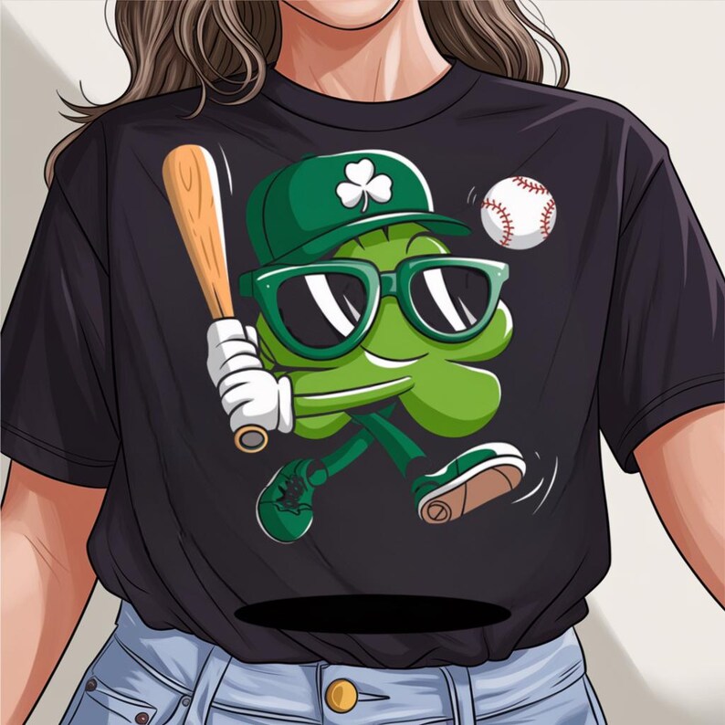May include: Black t-shirt featuring a cartoon shamrock wearing sunglasses and a baseball cap, holding a baseball bat and a baseball. The shamrock is green and the baseball is white with red stitching.