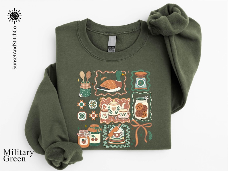 a green sweatshirt with a picture of a cat on it