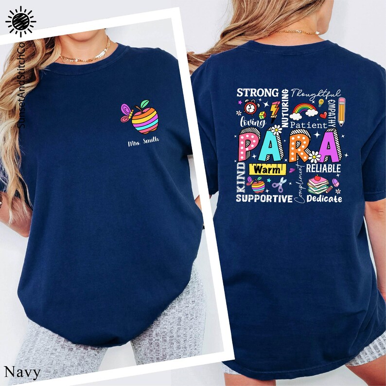 A navy blue t-shirt with a colorful graphic design on the back, featuring a rainbow-colored apple and various words related to support, dedication, and caring.