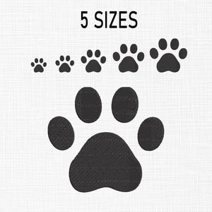May include: Five different sizes of black paw print embroidery designs. The largest paw print is in the center of the image.