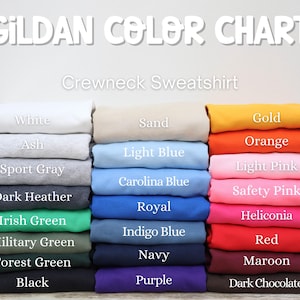 May include: A color chart for Gildan crewneck sweatshirts. The chart displays a variety of colors, including white, ash, sport gray, dark heather, Irish green, military green, forest green, black, sand, light blue, Carolina blue, gold, orange, light pink, safety pink, royal, indigo blue, navy, purple, red, maroon, and dark chocolate.