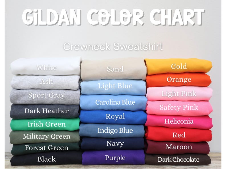 May include: A color chart for Gildan crewneck sweatshirts. The chart displays a variety of colors, including white, ash, sport gray, dark heather, Irish green, military green, forest green, black, sand, light blue, Carolina blue, gold, orange, light pink, safety pink, royal, indigo blue, navy, purple, red, maroon, and dark chocolate.