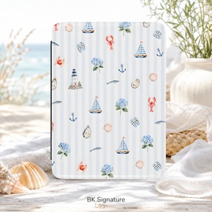 May include: A rectangular e-reader case featuring a light blue and white vertical striped pattern decorated with watercolor illustrations of sailboats, lighthouses, anchors, lobsters, crabs, seashells, fish, and blue hydrangea flowers.