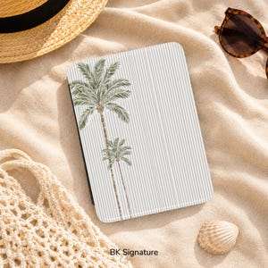 May include: A rectangular e-reader cover featuring a white background with thin vertical black stripes and a graphic illustration of two green palm trees on the left side. The cover displays the text BK Signature at the bottom center.