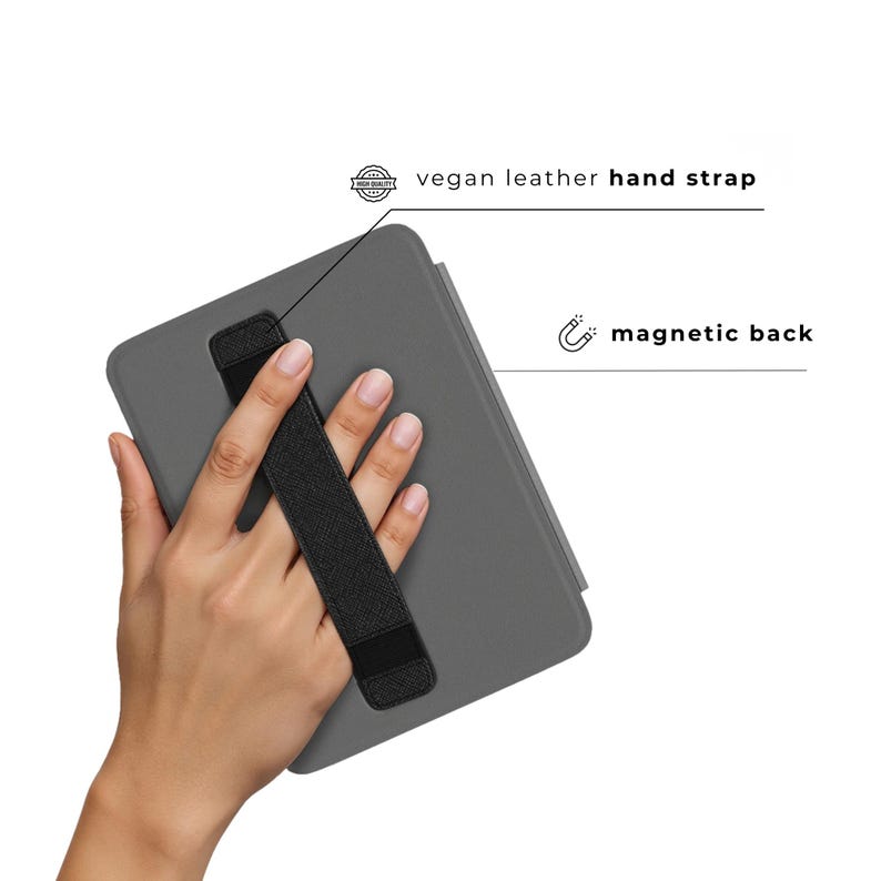 May include: A gray tablet case with a black vegan leather hand strap. The case has a magnetic back. Text on the image reads "vegan leather hand strap" and "magnetic back".