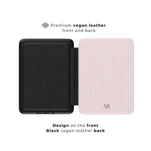 May include: Black vegan leather case with a pink and white striped front cover. The front cover has the initials "AR" in a matching pink color. The text "Premium vegan leather front and back" is visible.