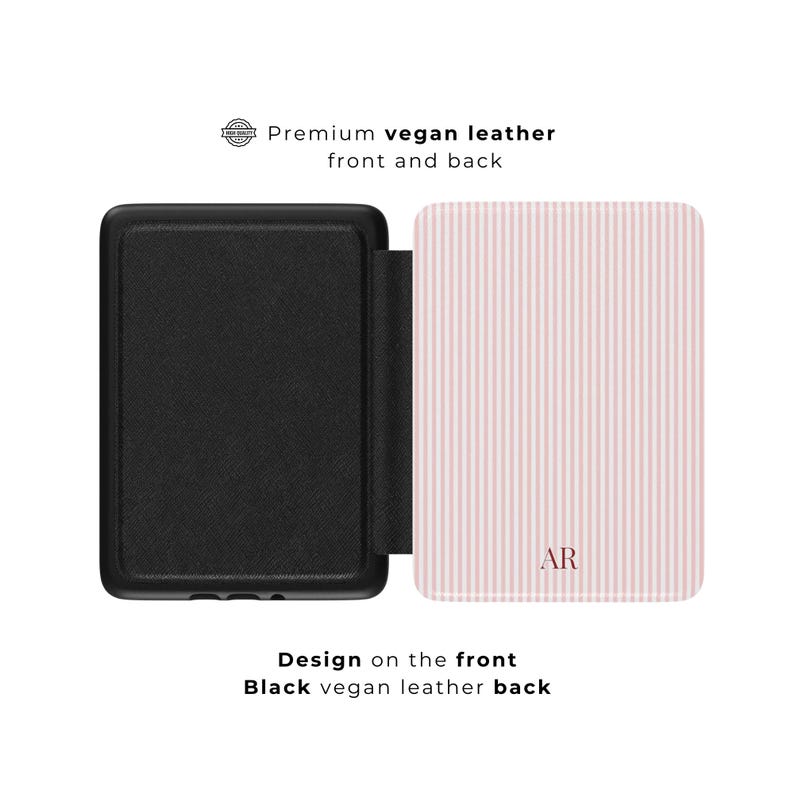 May include: Black vegan leather case with a pink and white striped front cover. The front cover has the initials "AR" in a matching pink color. The text "Premium vegan leather front and back" is visible.
