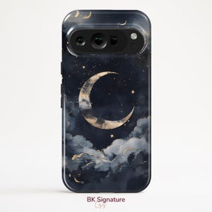 May include: A phone case with a night sky design, featuring a gold crescent moon, stars, and clouds against a navy blue background. The case has a glossy finish and the text "BK Signature" is visible.