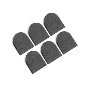 May include: Six dark grey, semi-circular objects with a textured surface are arranged on a white background. The objects are evenly spaced and have a rounded top and a flat bottom. The objects appear to be made of a solid material.