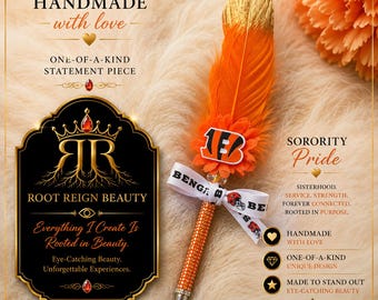 May include: A decorative pen featuring an orange feather with a gold-tipped end, a small orange flower, and a white ribbon printed with the text BENGALS. The pen barrel is covered in orange rhinestones, and the design includes a logo with the letters B.
