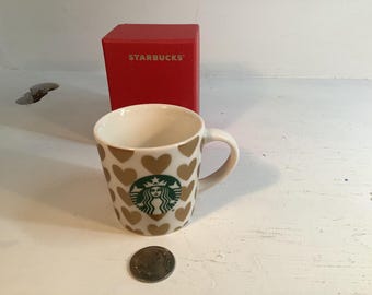 2015 Starbucks gold hearts espresso mug.