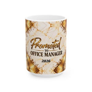 May include: A white ceramic mug featuring a gold and cream marble-patterned background with geometric gold accents. The text reads Promoted TO OFFICE MANAGER 2026 in a combination of elegant cursive and bold black lettering.