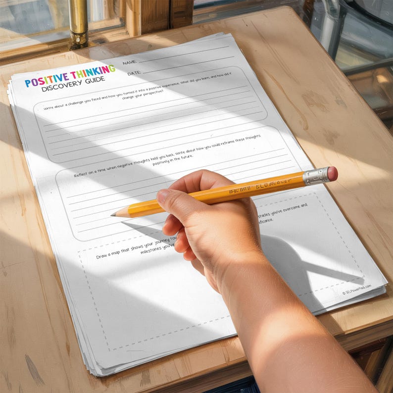 May include: A hand holding a yellow pencil with a pink eraser writes on a "Positive Thinking Discovery Guide" worksheet. The worksheet has lines for writing and prompts to reflect on positive experiences. The text on the pencil reads "DIXON Ticonderoga".