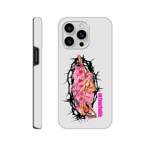 May include: White iPhone case featuring a black and pink graphic of a woman in a crown of thorns. The text "untouchable." is printed in pink on the case.