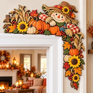 May include: A decorative wooden corner sign featuring a smiling scarecrow wearing a red and white checkered shirt, surrounded by orange pumpkins, yellow sunflowers, red berries, corn stalks, and autumn leaves in shades of red and orange.
