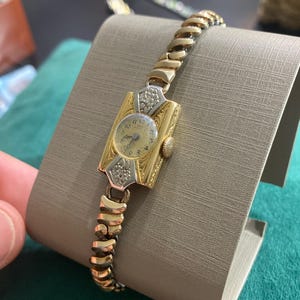 très ancienne montre - IMO 18 carats avec inserts en or blanc