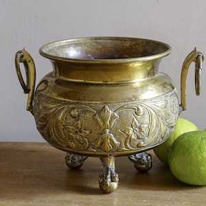 May include: A set of three ceramic mugs with a speckled, matte finish. The mugs are in shades of cream, light gray, and dark gray. Each mug has a simple, minimalist design and a rounded handle. Perfect for coffee or tea.