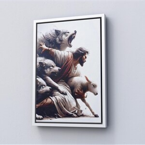 May include: A framed canvas art print showing a biblical scene. A man in a robe is surrounded by wolves and a lamb. The artwork has a white background and a white frame.