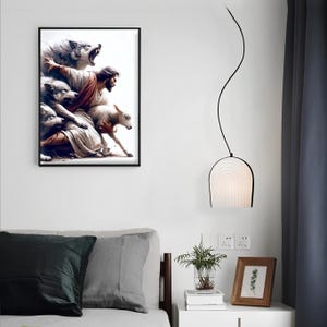 May include: A framed art print shows a religious scene with a figure, wolves, and a lamb. A modern pendant light with a black frame and a white, arched shade hangs nearby. The room has a minimalist aesthetic.
