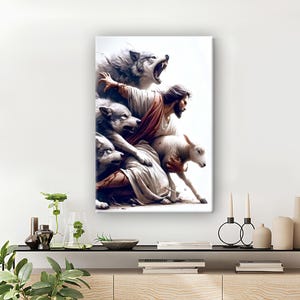 May include: A canvas print showing a religious scene. A figure in white robes is surrounded by wolves and a lamb. The artwork has a dramatic, illustrative style with a bright, white background. The wolves are snarling, and the lamb appears vulnerable.