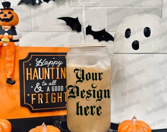 May include: A Halloween-themed display with a glass tumbler containing a drink, topped with a bamboo lid. The glass is inscribed with "Your Design Here". The scene includes orange pumpkins, black bat decorations, and a sign that reads "Happy HAUNTIN to all & A GOOD FRIGHT".